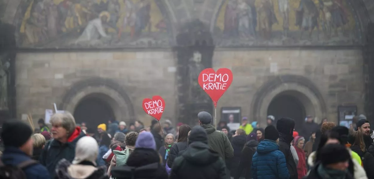 People in Germany demonstrate with heart-shaped signs reading ‘Democracy’. Picture: Izabela Mittwollen/dpa (Photo: Izabela Mittwollen)