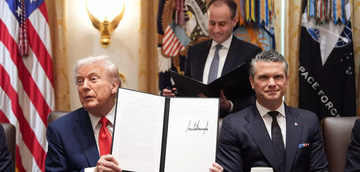 President Donald Trump speaks during a cabinet meeting at the White House, Thursday, Oct. 9, 2025, in Washington, as Defense Secretary Pete Hegseth looks on. (AP Photo/Evan Vucci) (Photo: Evan Vucci)