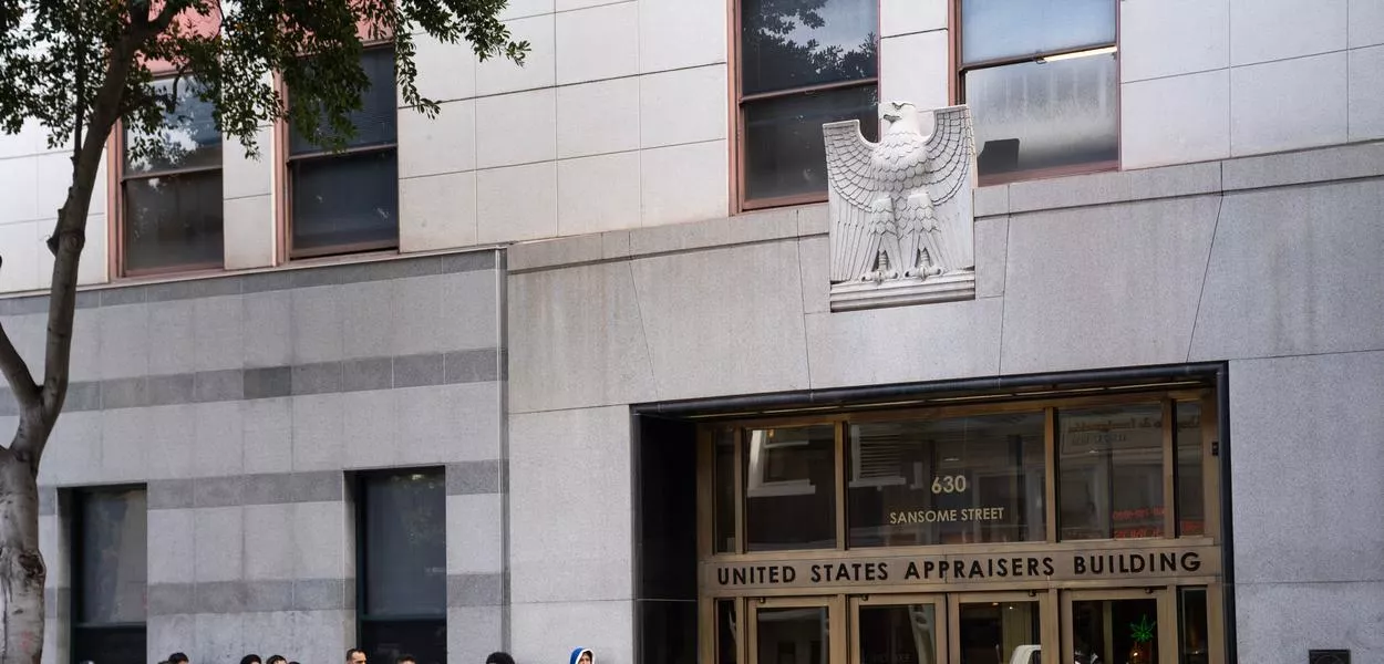 People wait outside immigration court of the US immigration and customs enforcement field office in San Francisco. A British political commentator was detained by ICE in the West Coast city. (Photo: AP Photo/Minh Connors)