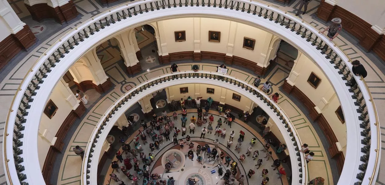 Protesters outside the House of Representatives chamber in the Texas State Capitol as lawmakers debate a newly redrawn map of the US Congress in Texas. (Photo: Eric Gay)