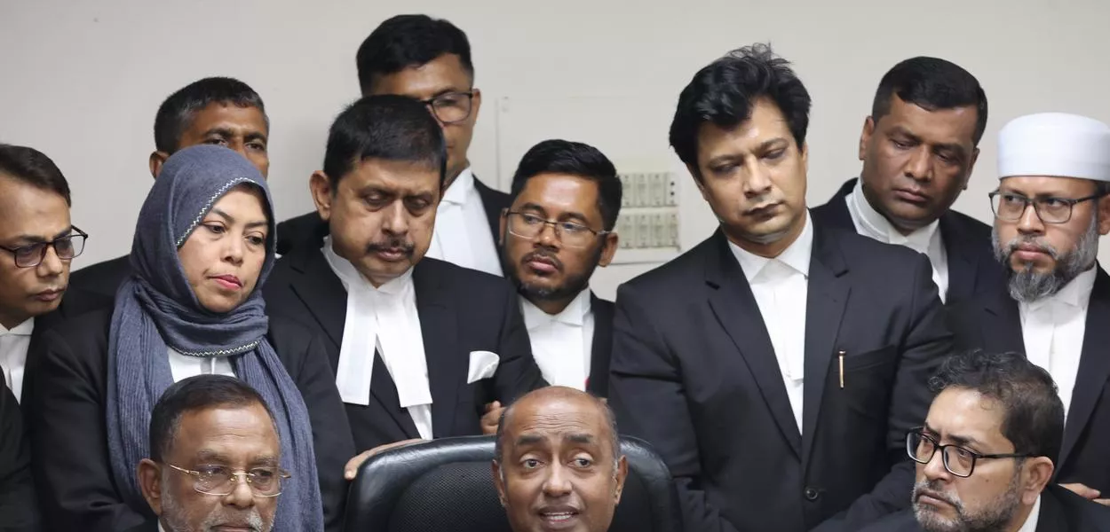 Bangladesh Attorney General Md Asaduzzaman, center sitting, and senior lawyers address a press conference after Supreme Court restored a nonpartisan caretaker government system for national elections but said it won't apply to the polls being held early next year, in Dhaka, Bangladesh, Thursday, Nov. 20, 2025. (Photo: AP Photo/Abdul Goni)