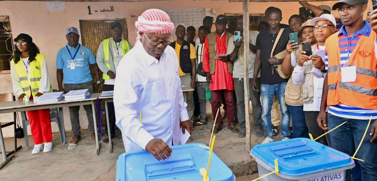In this photo released by the Communication office Presidency republic of Guinea Bissau, incumbent President Umaro Sissoco Embaló  casts his votes at a polling station during the Presidential and legislative elections in Bissau, Guinea-Bissau, Sunday, Embaló has now been forced into exile. (Communication office Presidency republic of Guinea Bissau via AP)