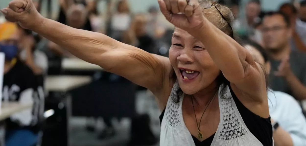 The mother of a drug war victim, Isabelita Espinosa, jubilates after appeals judges at the International Criminal Court rejected a request to release former Philippine President Rodrigo Duterte on health grounds as people watch a livestream in Quezon city, Philippines, Friday, Nov. 28, 2025. (AP Photo/Aaron Favila) (Photo: Aaron Favila)
