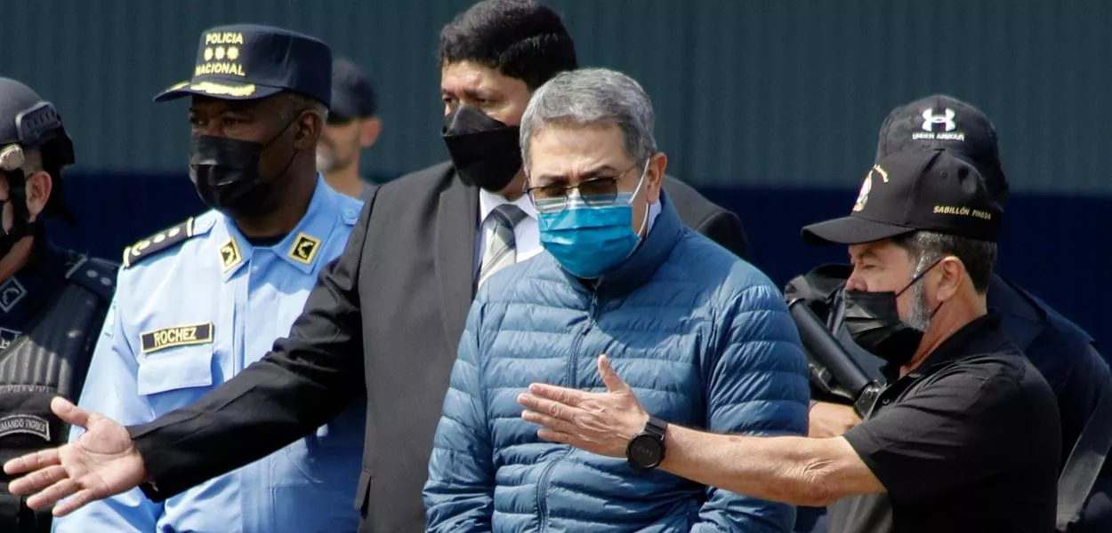 FILE - Former Honduran President Juan Orlando Hernandez, second from right, is taken in handcuffs to a waiting aircraft as he is extradited to the United States, at an Air Force base in Tegucigalpa, Honduras, April 21, 2022. (AP Photo/Elmer Martinez, File) (Photo: Elmer Martinez)