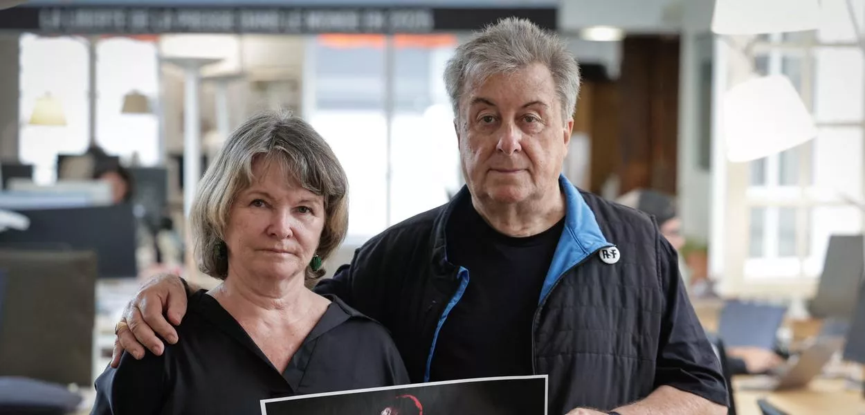 French sports journalist Christophe Gleizes' mother Sylvie Godard and his stepfather Francis Godard pose during a photo session at the International press freedom watchdog Reporters sans frontieres headquarters in Paris in August 2025. Gleizes conviction got confirmed in a Court of Appeals in December. A presidential pardon is now needed for his release. (Photo: Stephane de Sakutin/AFP)