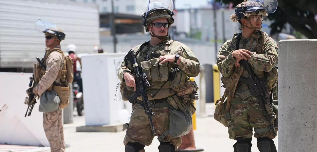 FILE - Members of the California National Guard and U.S. Marines guard a federal building on Tuesday, June 17, 2025, in Los Angeles. (AP Photo/Damian Dovarganes, File) (Photo: Damian Dovarganes)
