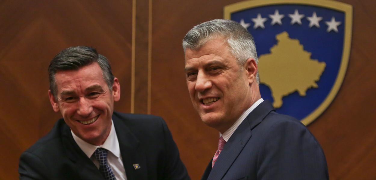 The then Speaker of the Kosovar Parliament, Kadri Veseli (left), congratulates the then newly elected President of Kosovo, Hashim Thaci (right), during a parliamentary session in the Kosovar capital, Pristina on 26 February 2016. (Photo: Visar Kryeziu/AP/dpa)